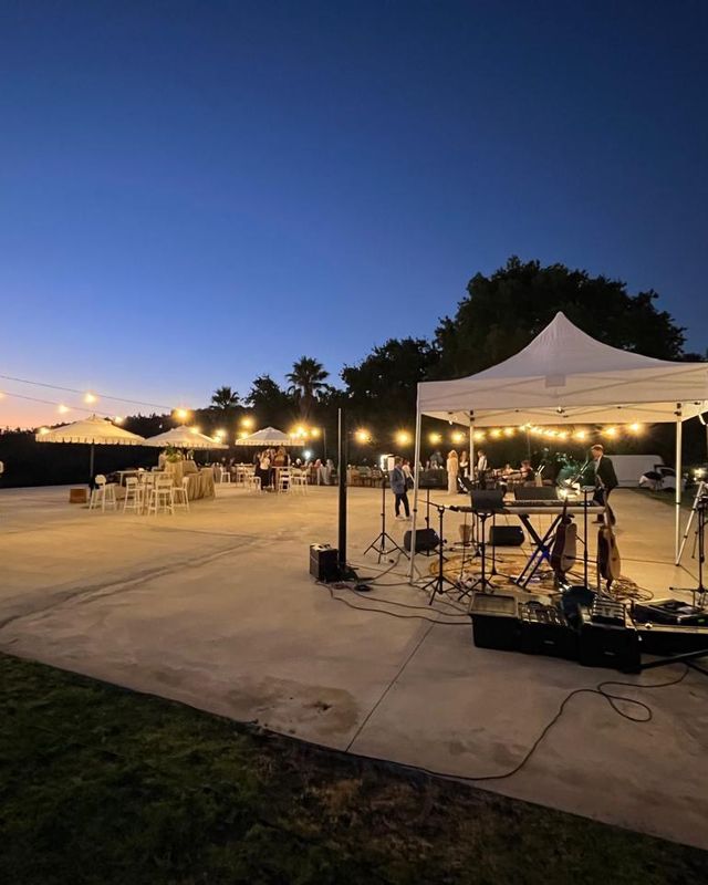The terrace under festoon lights after dark